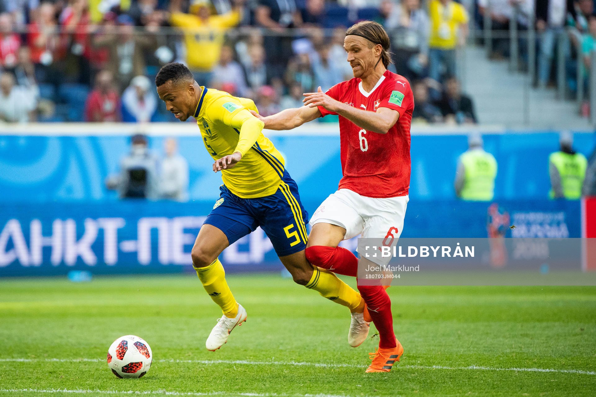 Martin Olsson falls and is awarded a free kick in a duel with Michael Lang of Switzerland during the FIFA World Cup round of 16 match between Sweden and Switzerland on July 3, 2018 in St Petersburg.