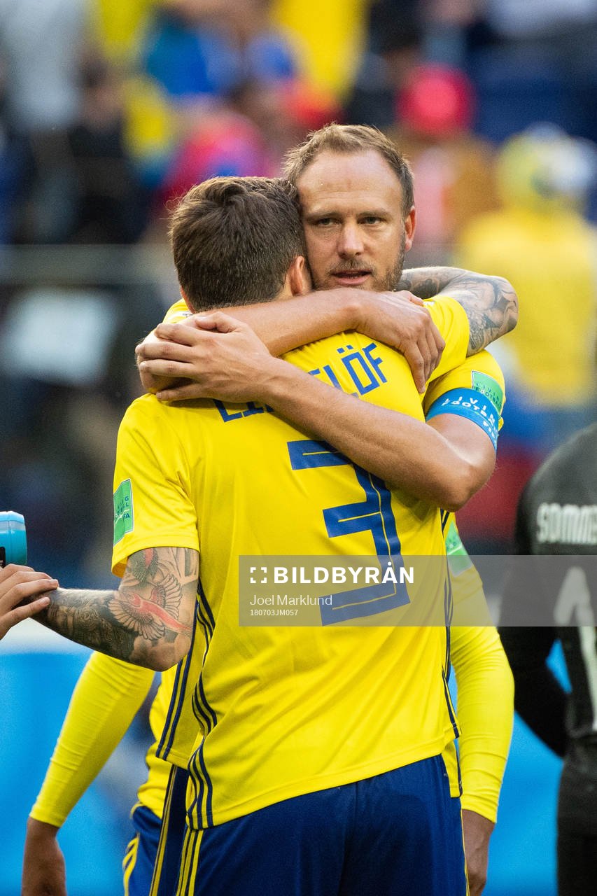 Andreas Granqvist hugs Victor Nilsson Lindelöf of Sweden
