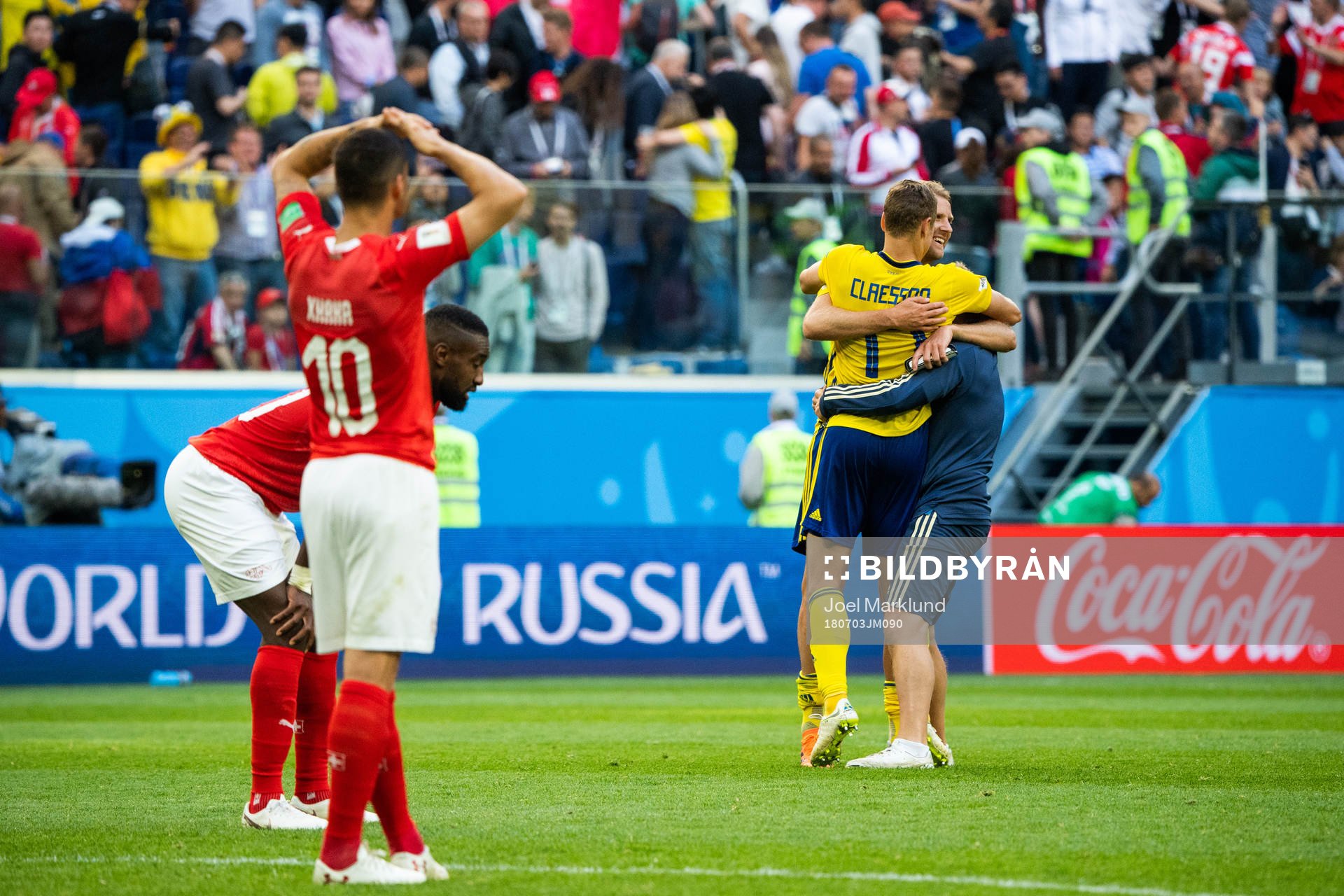 Players of Switzerland looks dejected while Viktor Claesson
