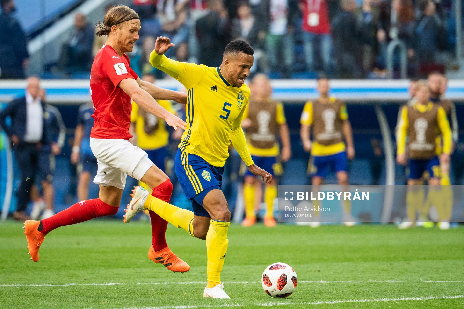 Martin Olsson falls and is awarded a penalty in a duel with Michael Lang of Switzerland during the FIFA World Cup round of 16 match between Sweden and Switzerland on July 3, 2018 in St Petersburg.