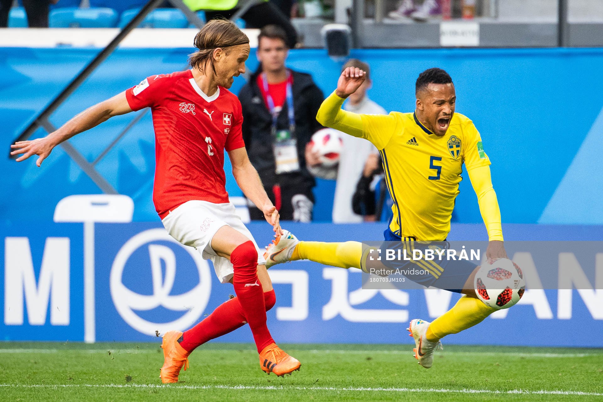 Martin Olsson falls and is awarded a penalty in a duel with Michael Lang of Switzerland during the FIFA World Cup round of 16 match between Sweden and Switzerland on July 3, 2018 in St Petersburg.
