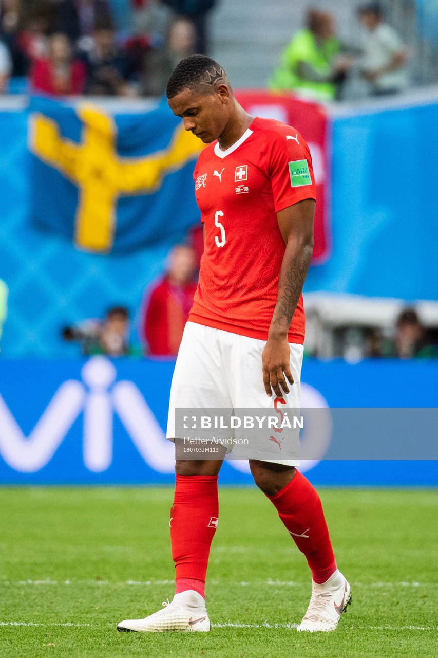 Manuel Akanji of Switzerland looks dejected
