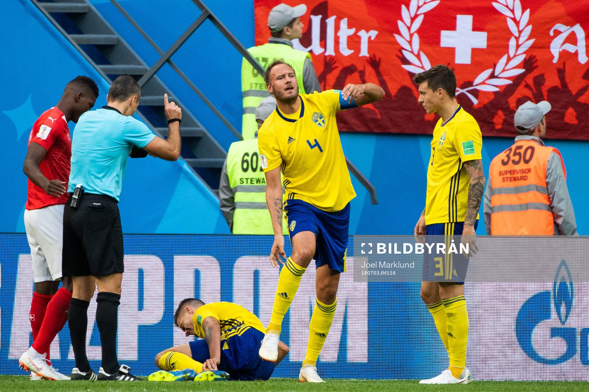 Andreas Granqvist gestures that Mikael Lustig of Sweden is