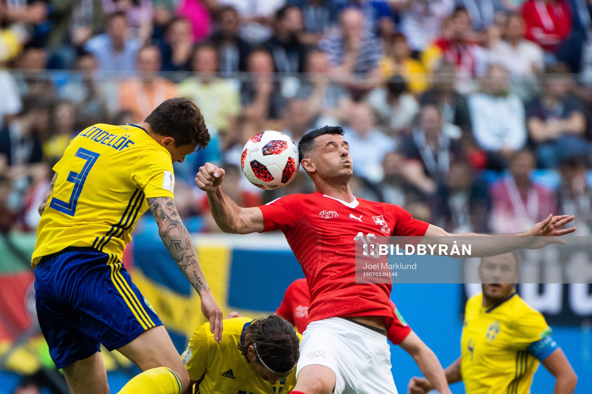 Victor Nilsson Lindelöf of Sweden and Blerim Dzemaili of