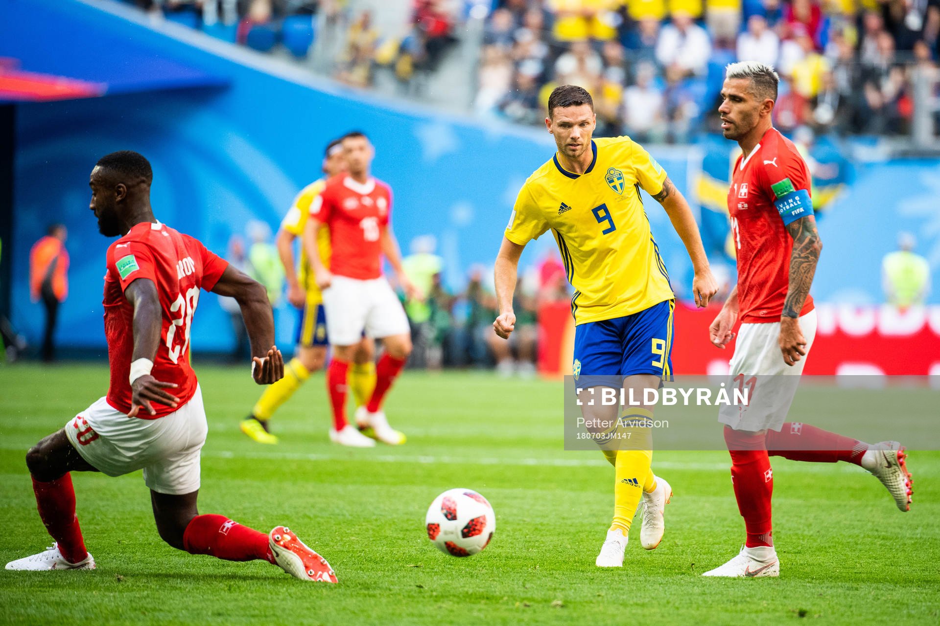 Marcus Berg of Sweden and Valon Behrami of Switzerland