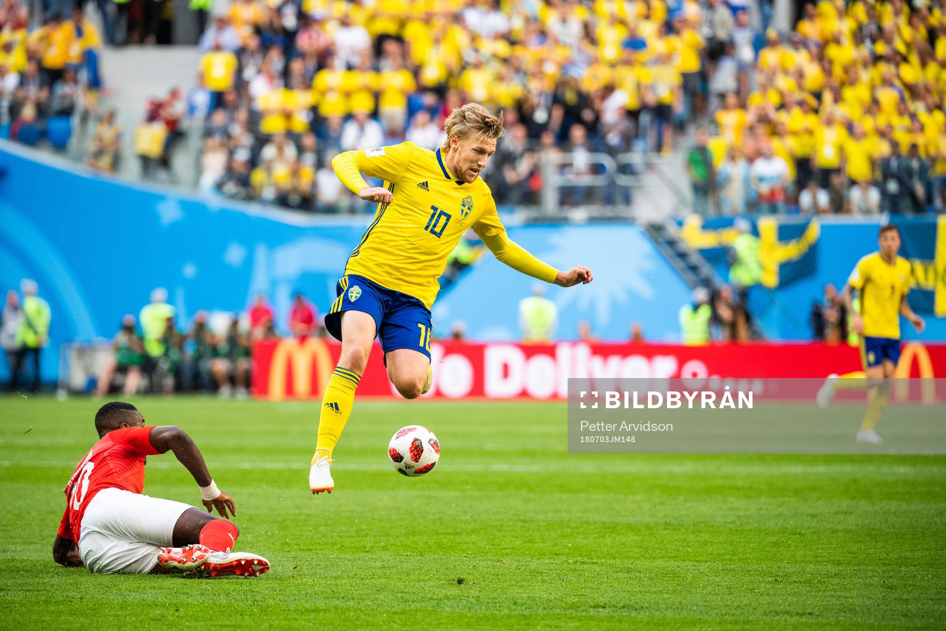 Johan Djourou of Switzerland tackles Emil Forsberg of Sweden