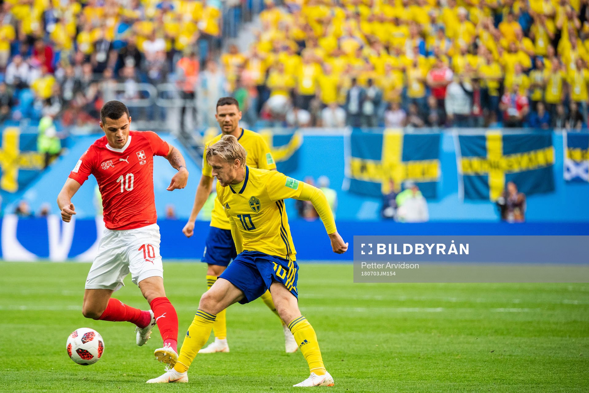 Granit Xhaka of Switzerland and Emil Forsberg of Sweden