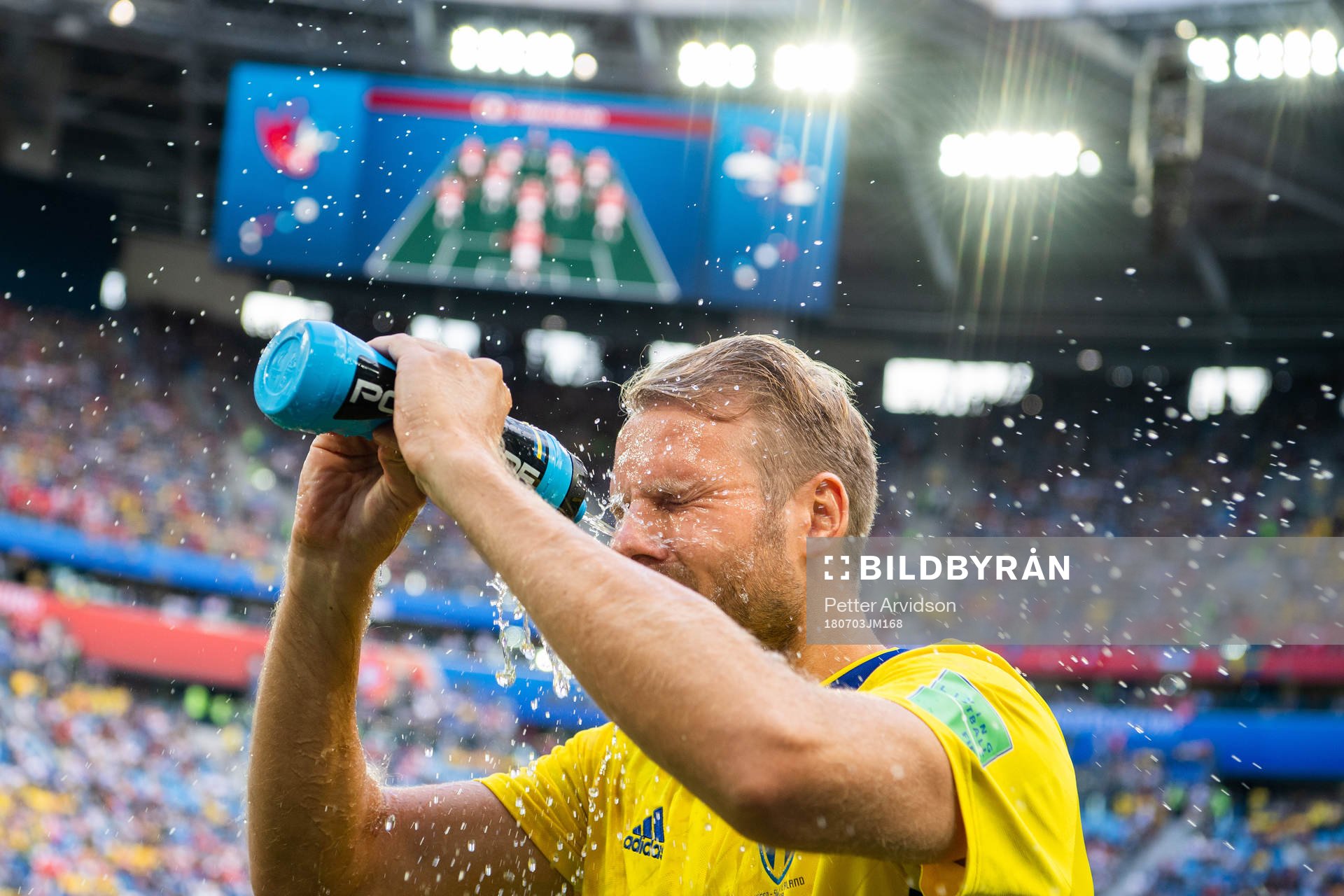 Ola Toivonen sprays water in his face prior to the FIFA
