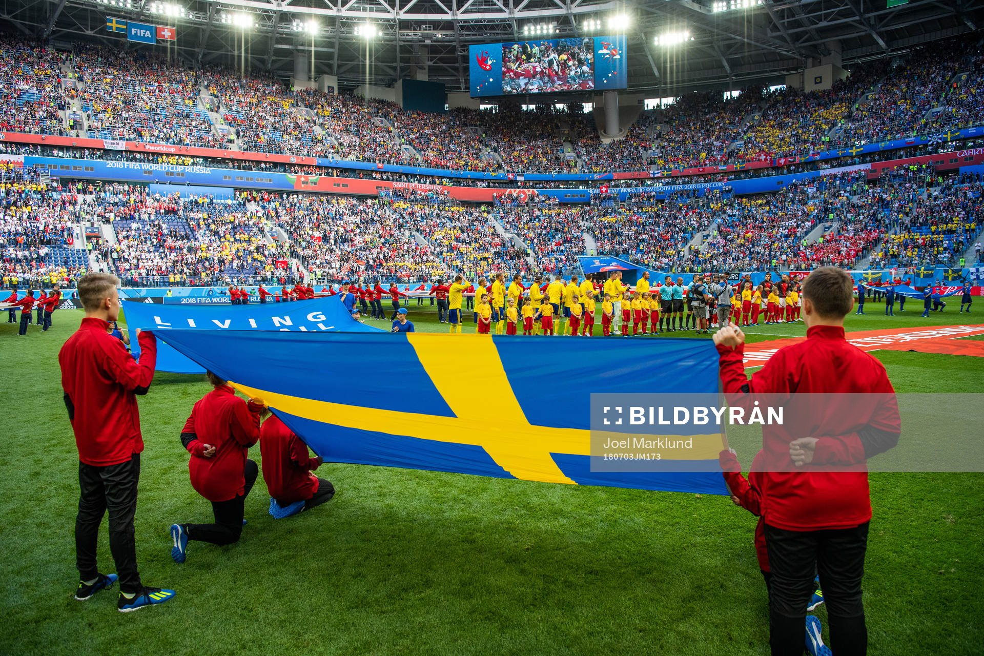 Line up with a Swedish flag in the foreground prior to the