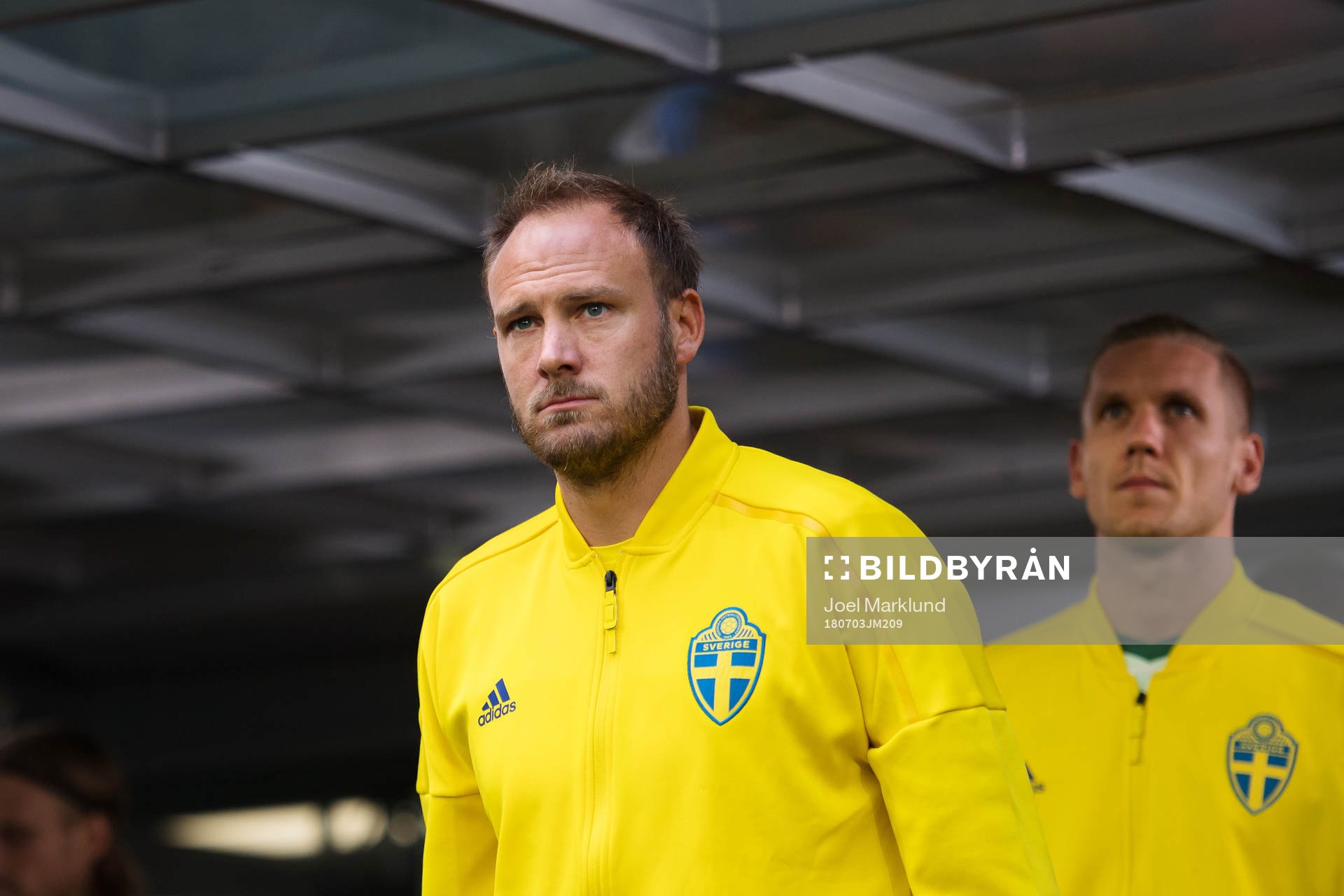 Andreas Granqvist and goalkeeper Robin Olsen of Sweden