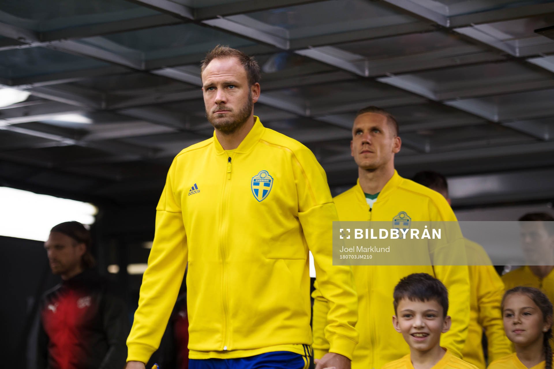 Andreas Granqvist and goalkeeper Robin Olsen of Sweden