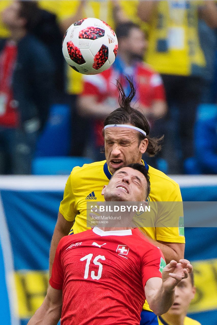 Gustav Svensson of Sweden and Blerim Dzemaili of Switzerland