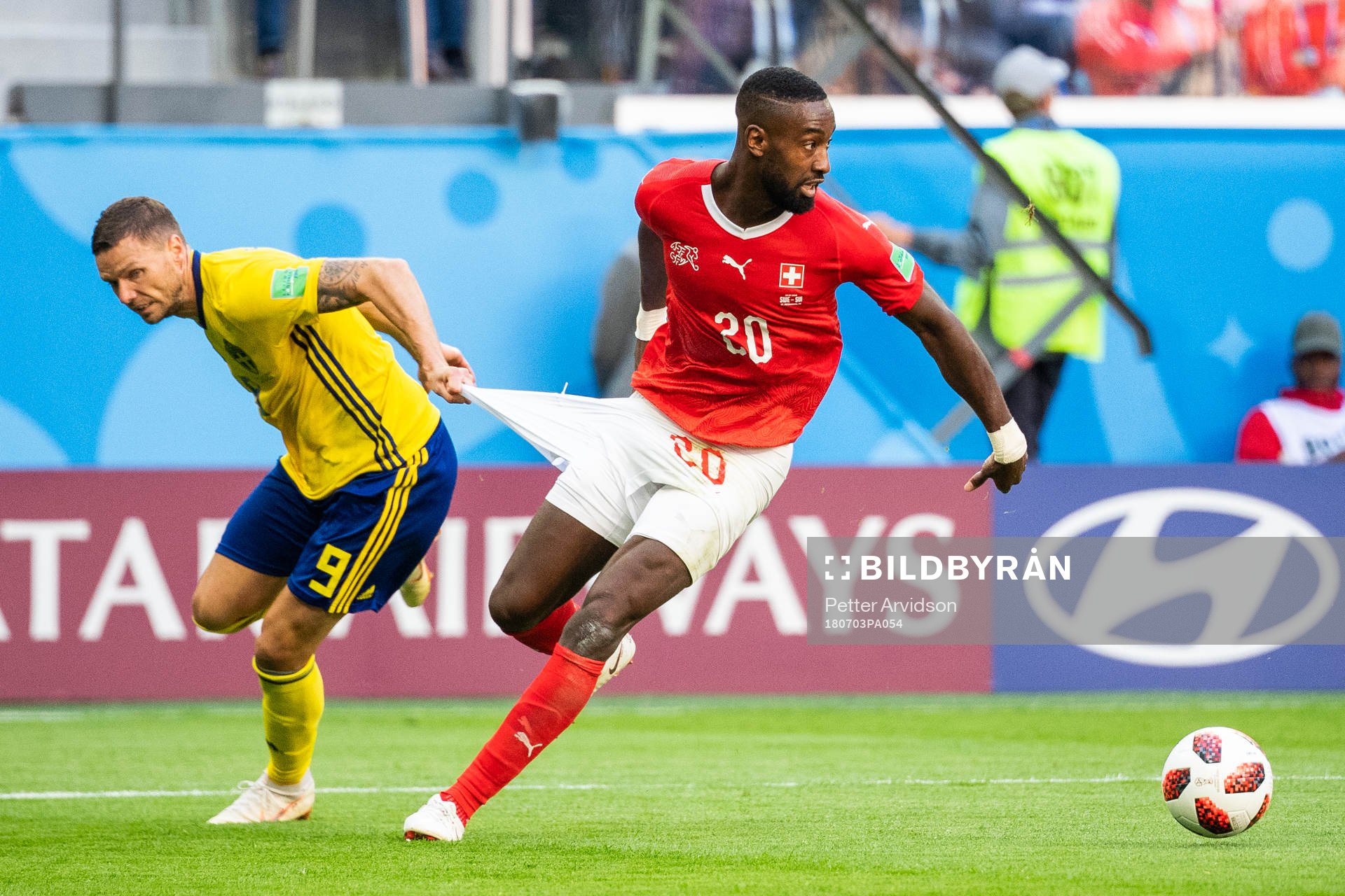 Marcus Berg of Sweden and Johan Djourou of Switzerland