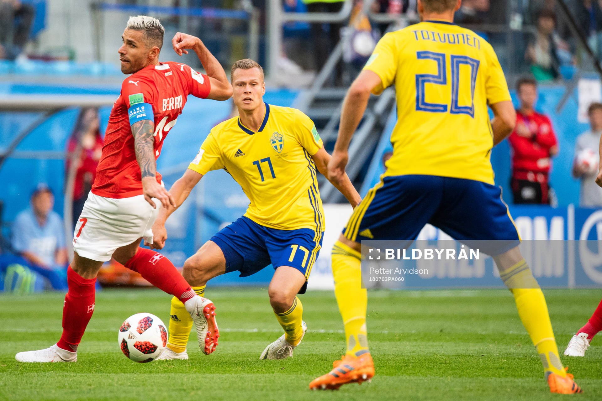 Viktor Claesson of Sweden and Valon Behrami of Switzerland