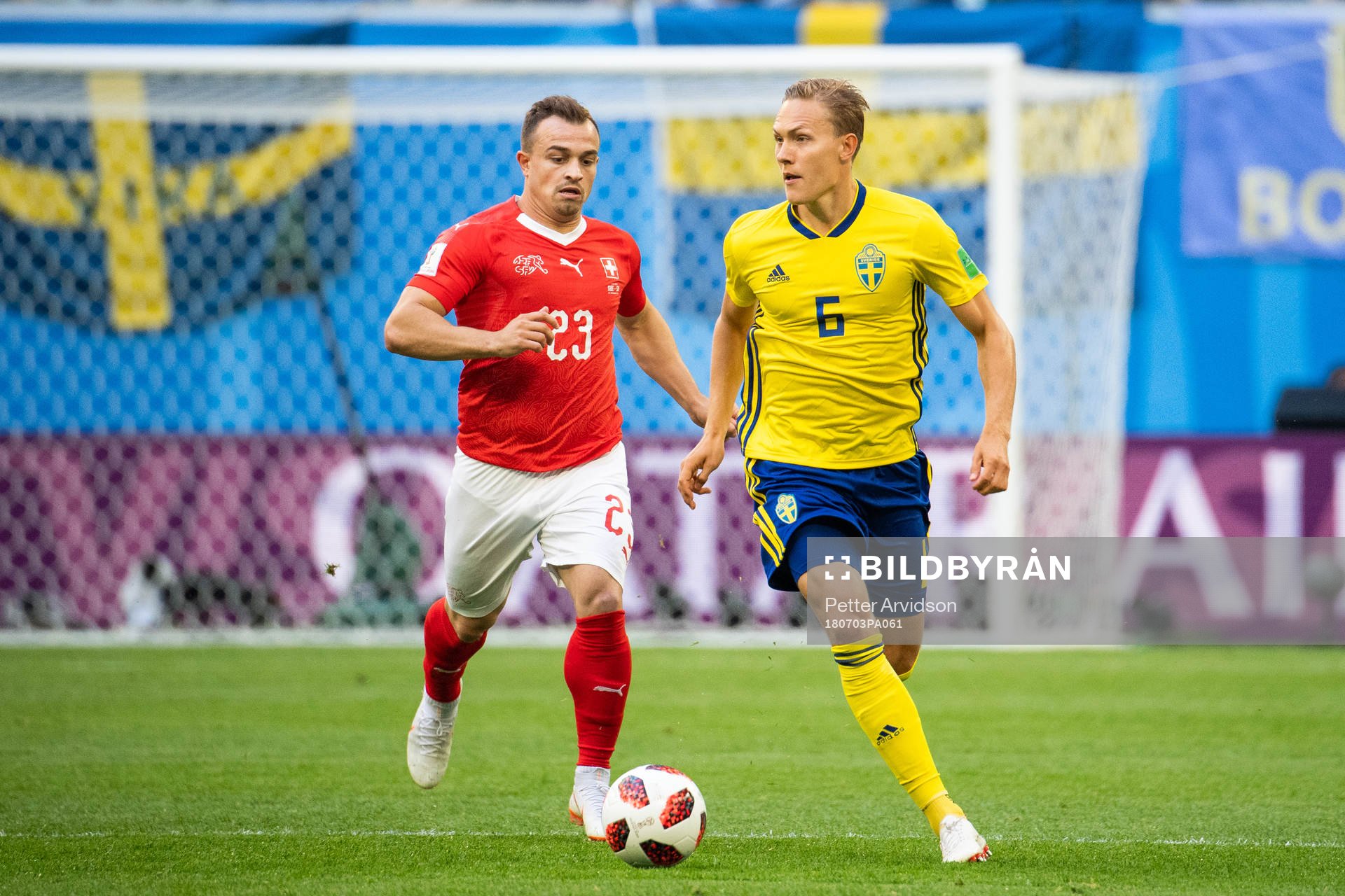Xherdan Shaqiri of Switzerland and Ludwig Augustinsson of
