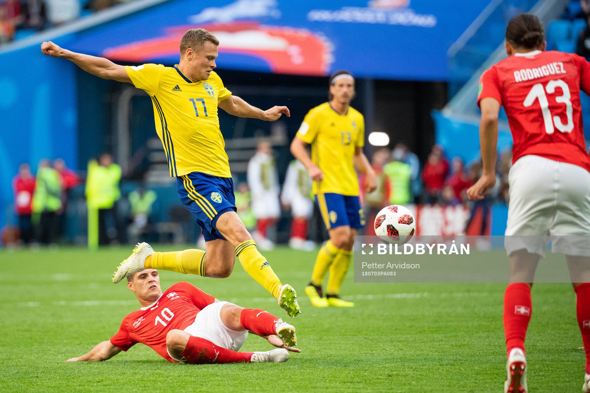 Granit Xhaka of Switzerland competes for the ball with