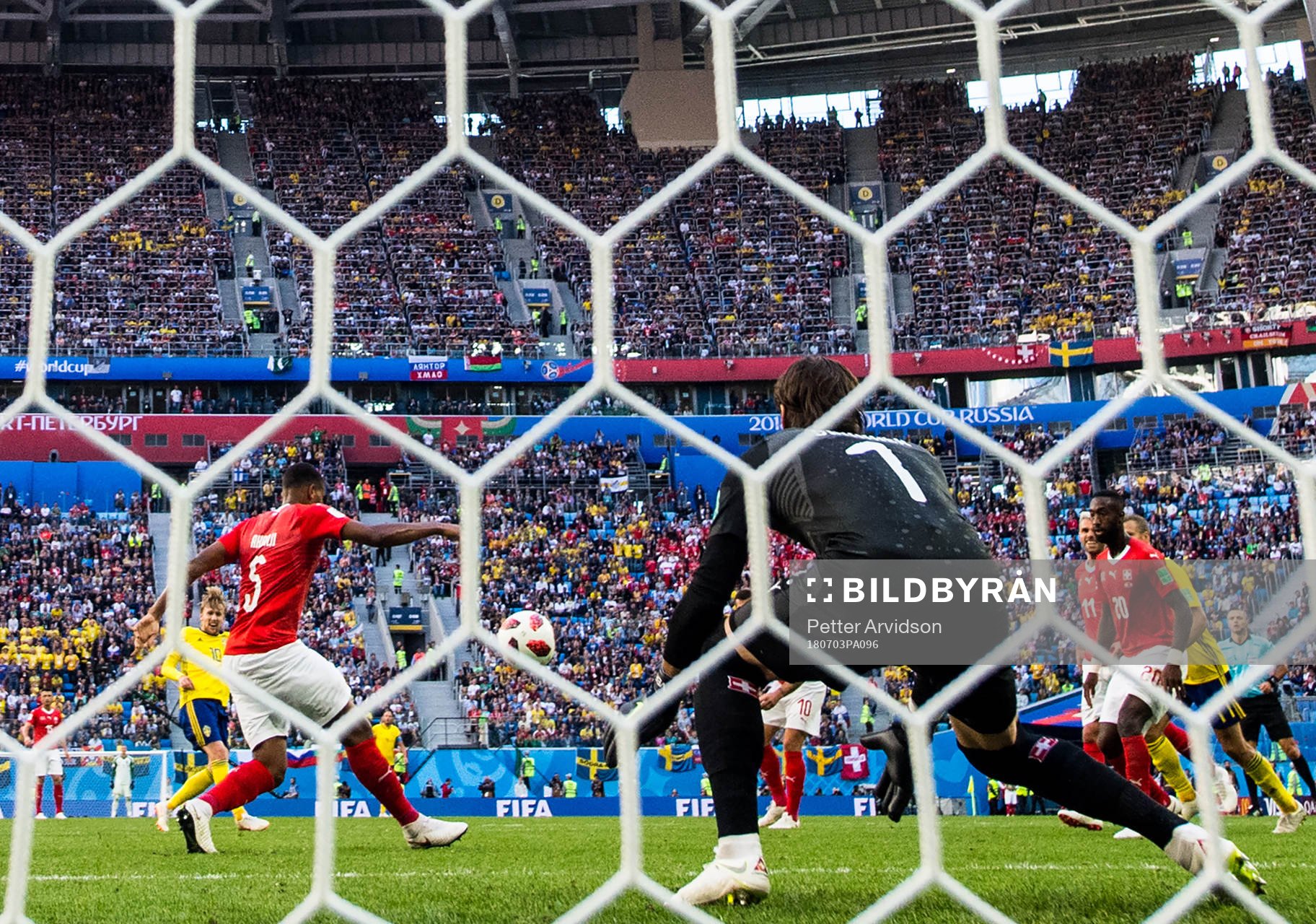 Emil Forsberg of Sweden scores 1-0 behind goalkeeper Yann
