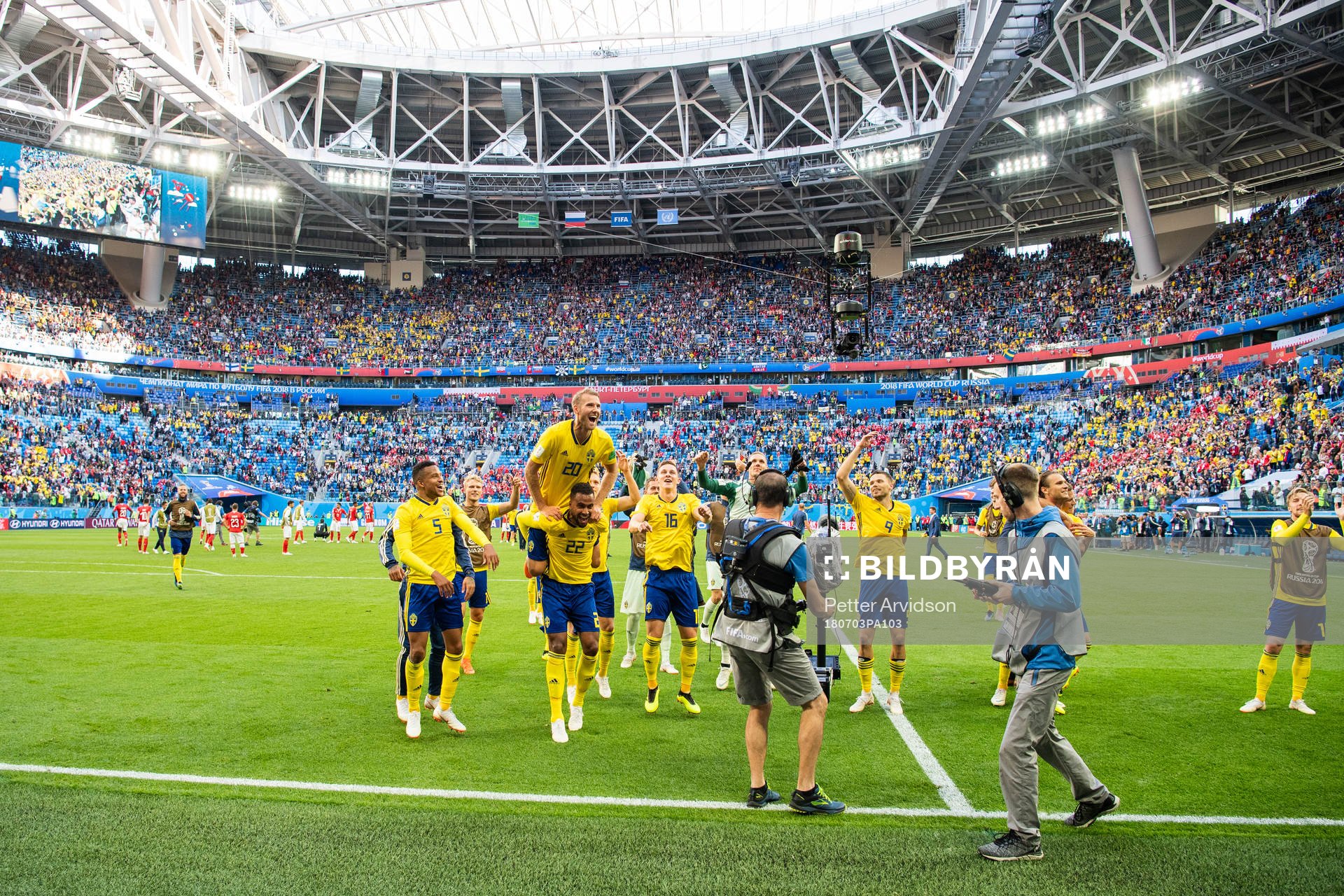 Ola Toivonen jumps up onto the back of Isaac Kiese Thelin