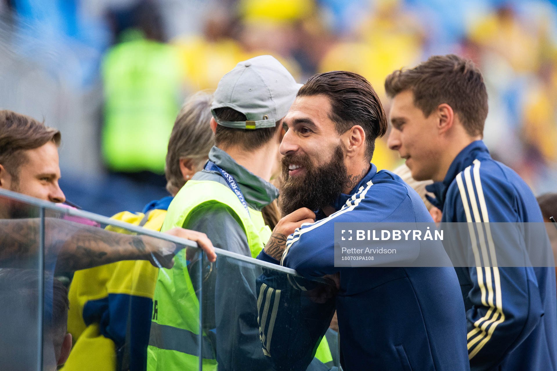 Jimmy Durmaz of Sweden talks to relatives