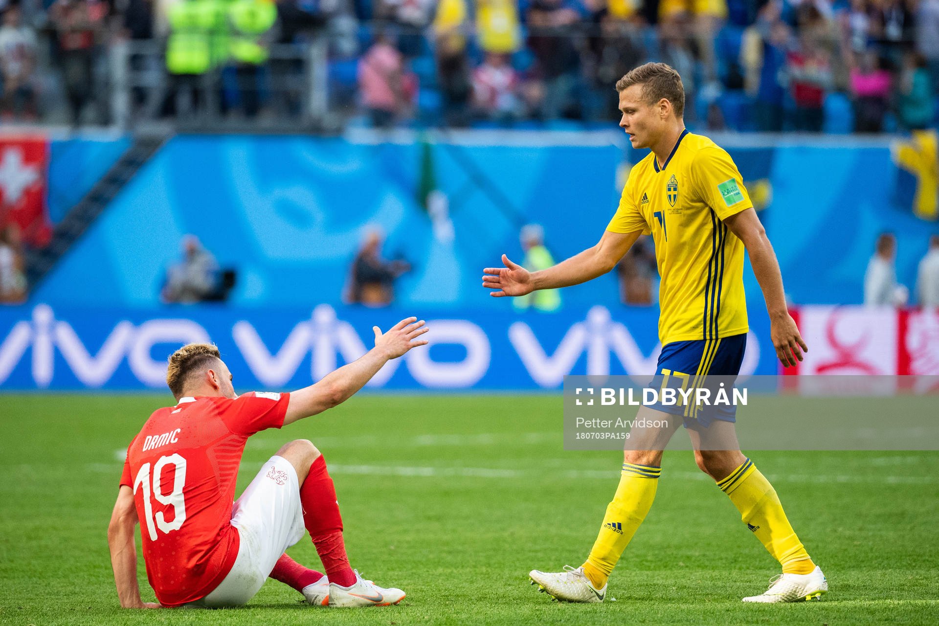 Viktor Claesson of Sweden thanks Josip Drmic of Switzerland