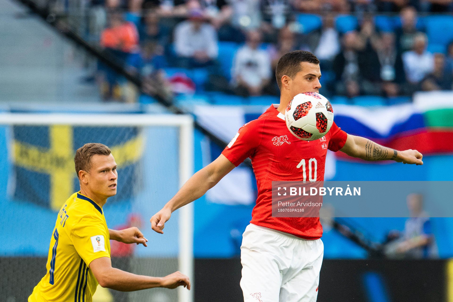 Viktor Claesson of Sweden and Granit Xhaka of Switzerland