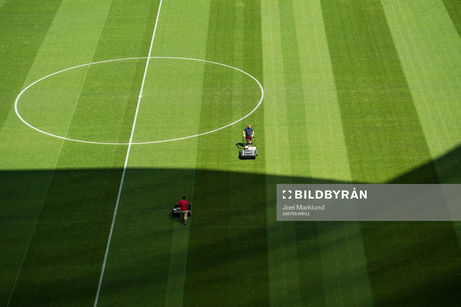 Workers prepare the pitch at Samara Arena
