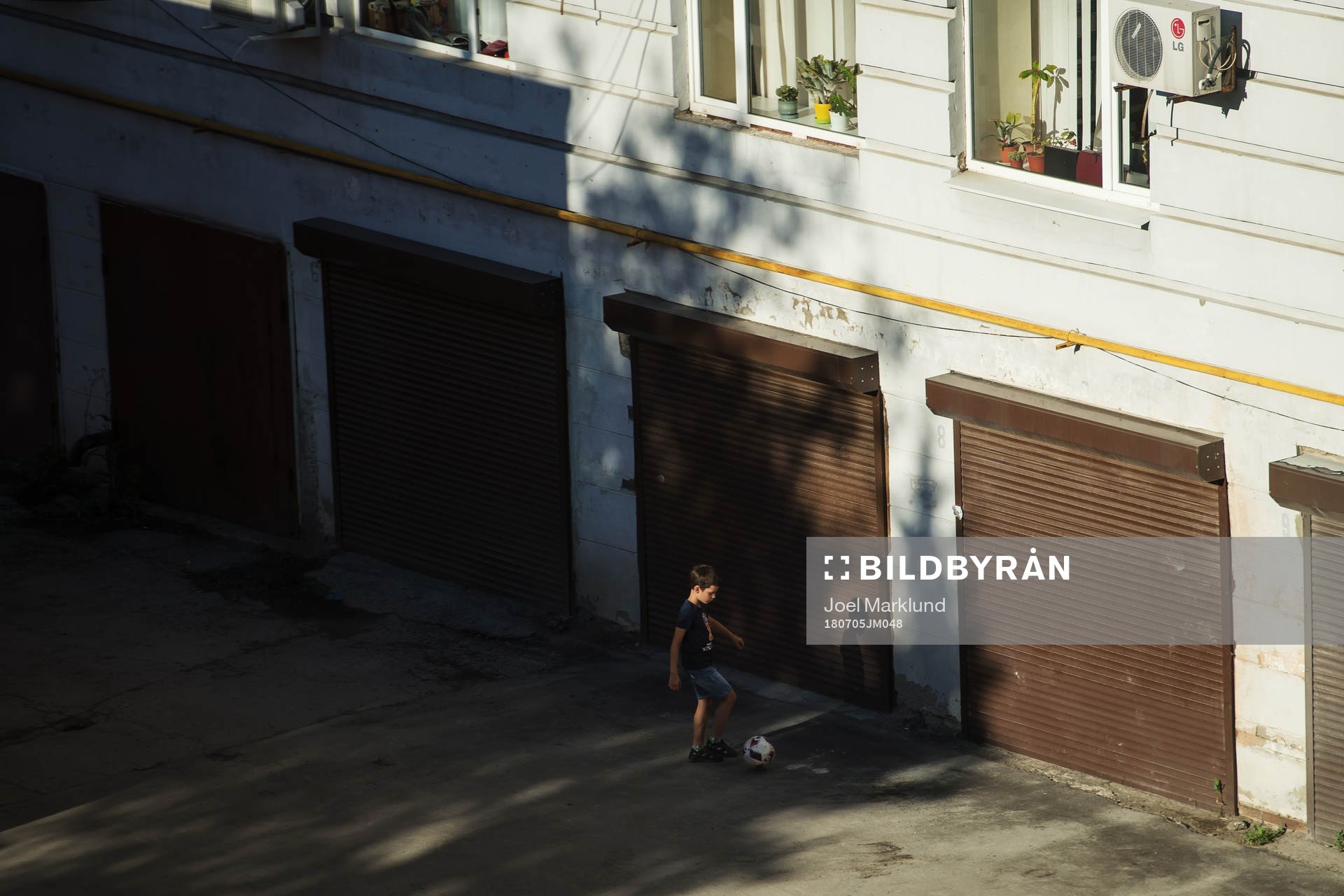 A kid plays football