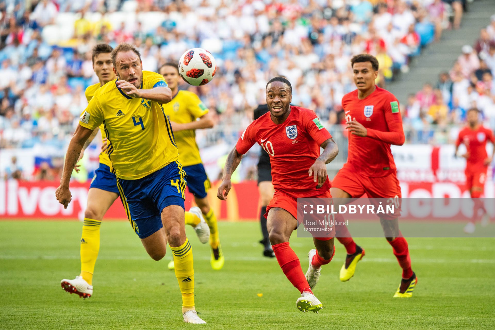 Andreas Granqvist of Sweden and Raheem Sterling of England
