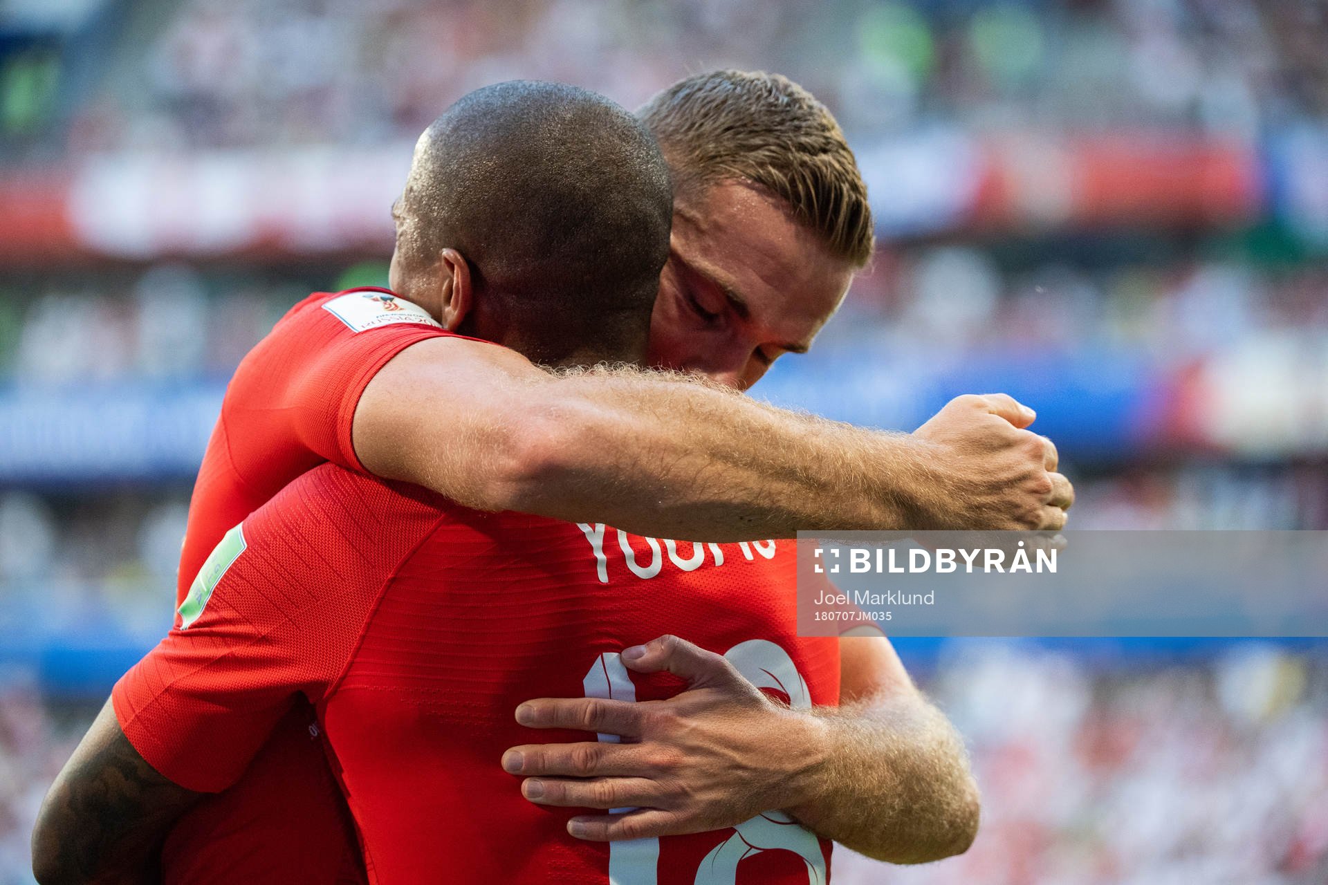 Jordan Henderson hugs Ashley Young