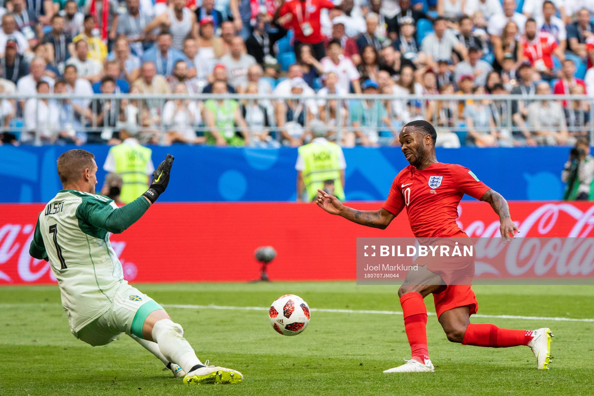 Goalkeeper Robin Olsen of Sweden and Raheem Sterling of