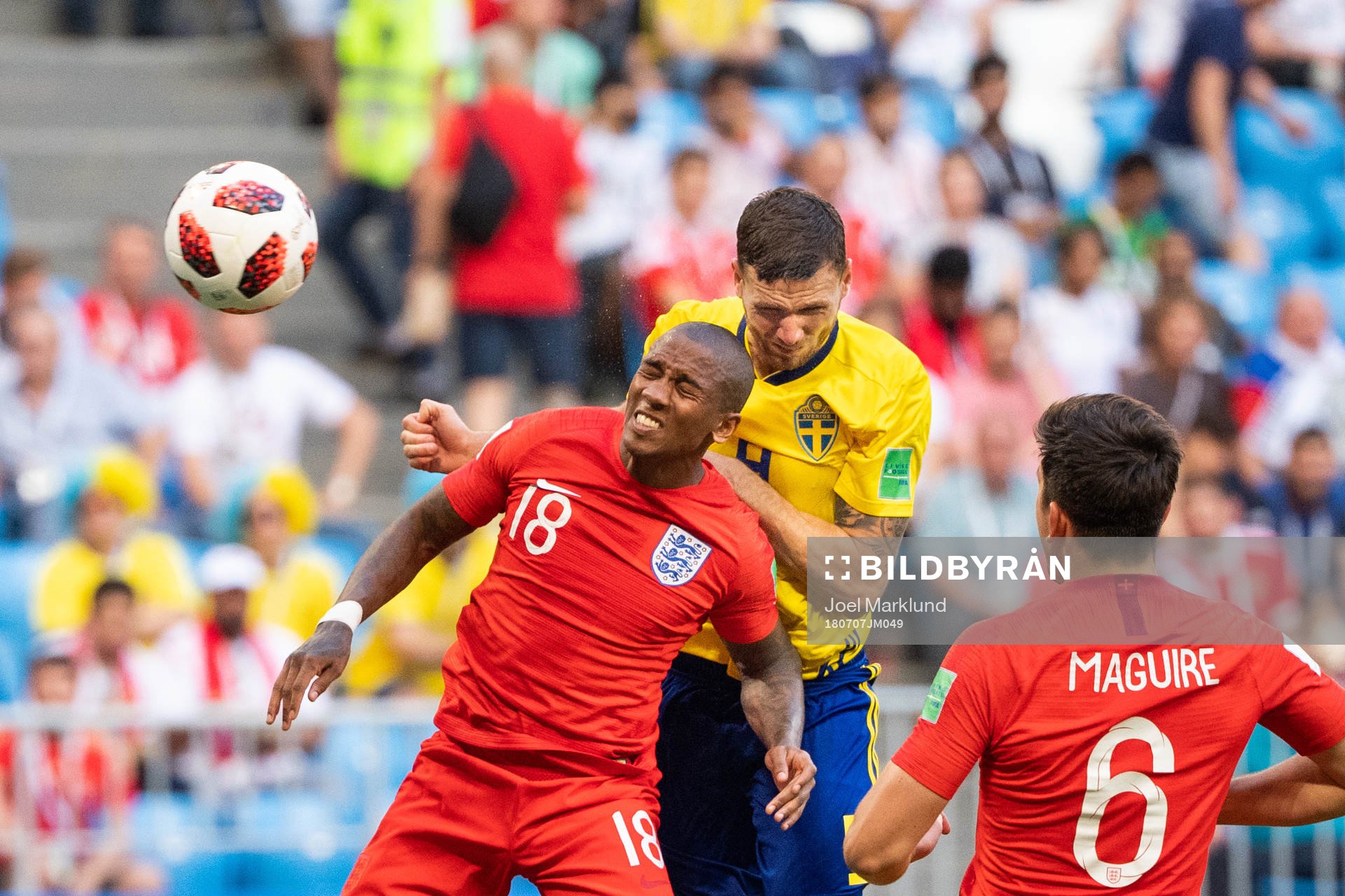 Ashley Young of England and Marcus Berg of Sweden competes