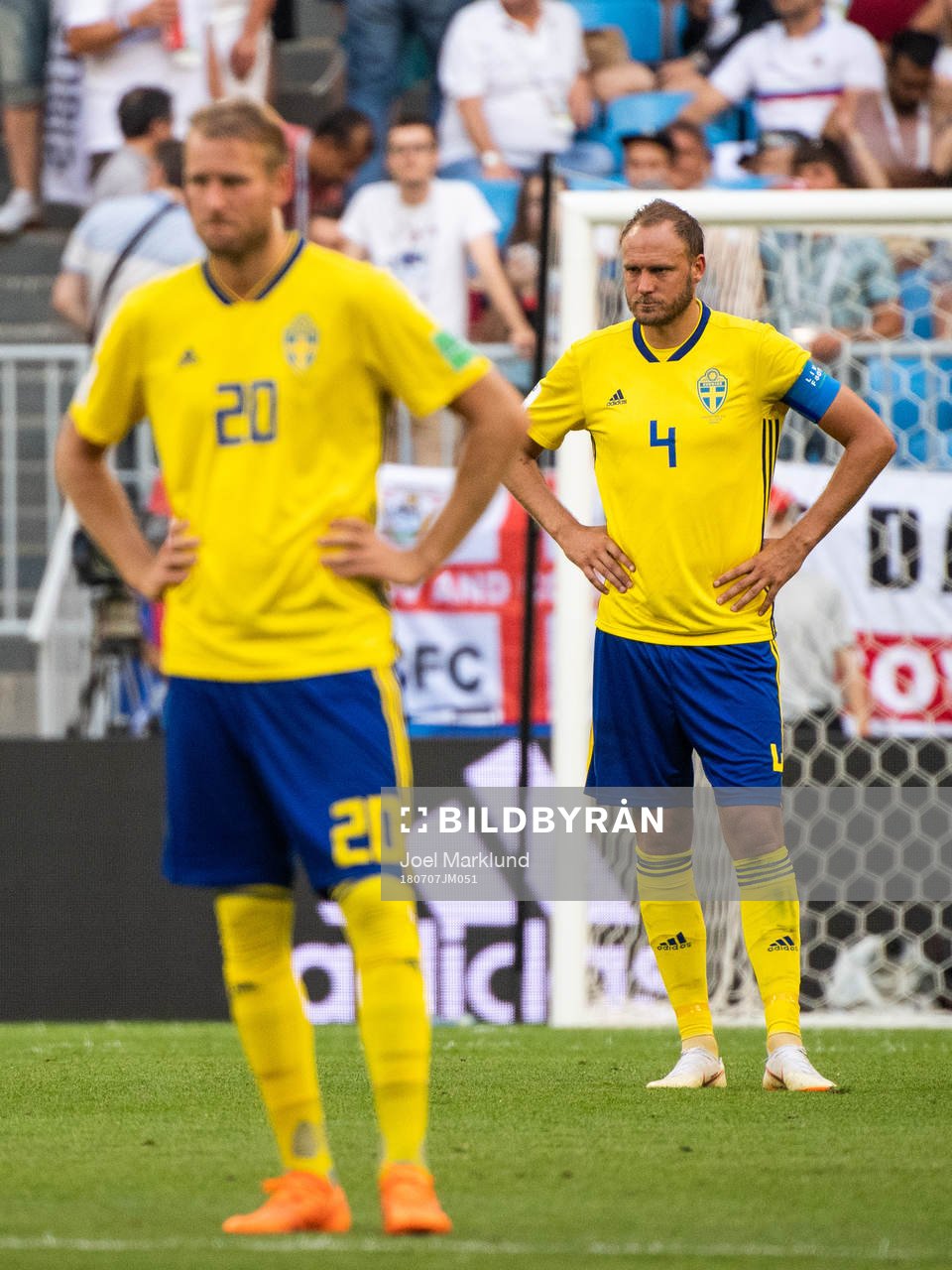 Ola Toivonen and Andreas Granqvist of Sweden looks dejected
