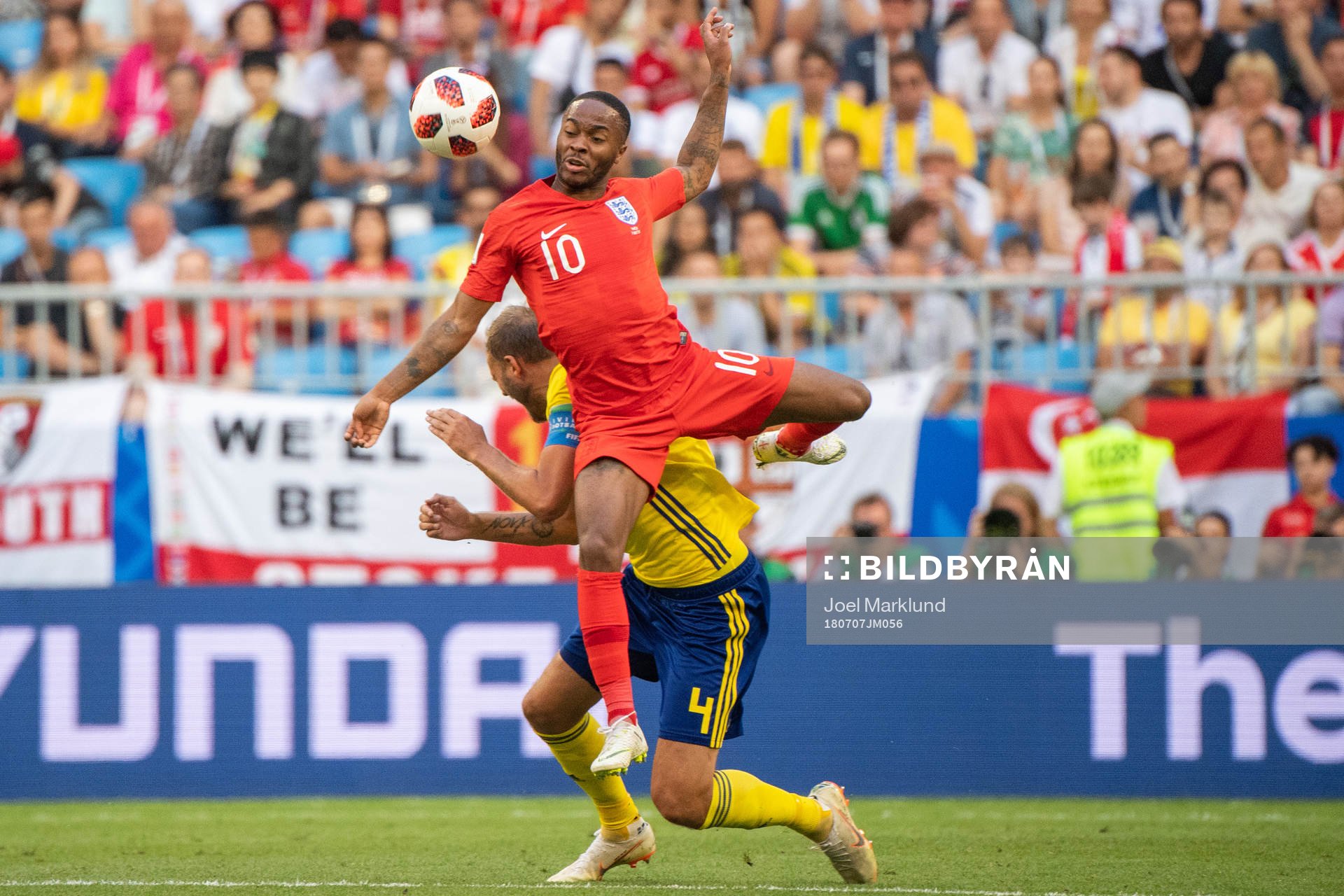 Andreas Granqvist of Sweden and Raheem Sterling of England