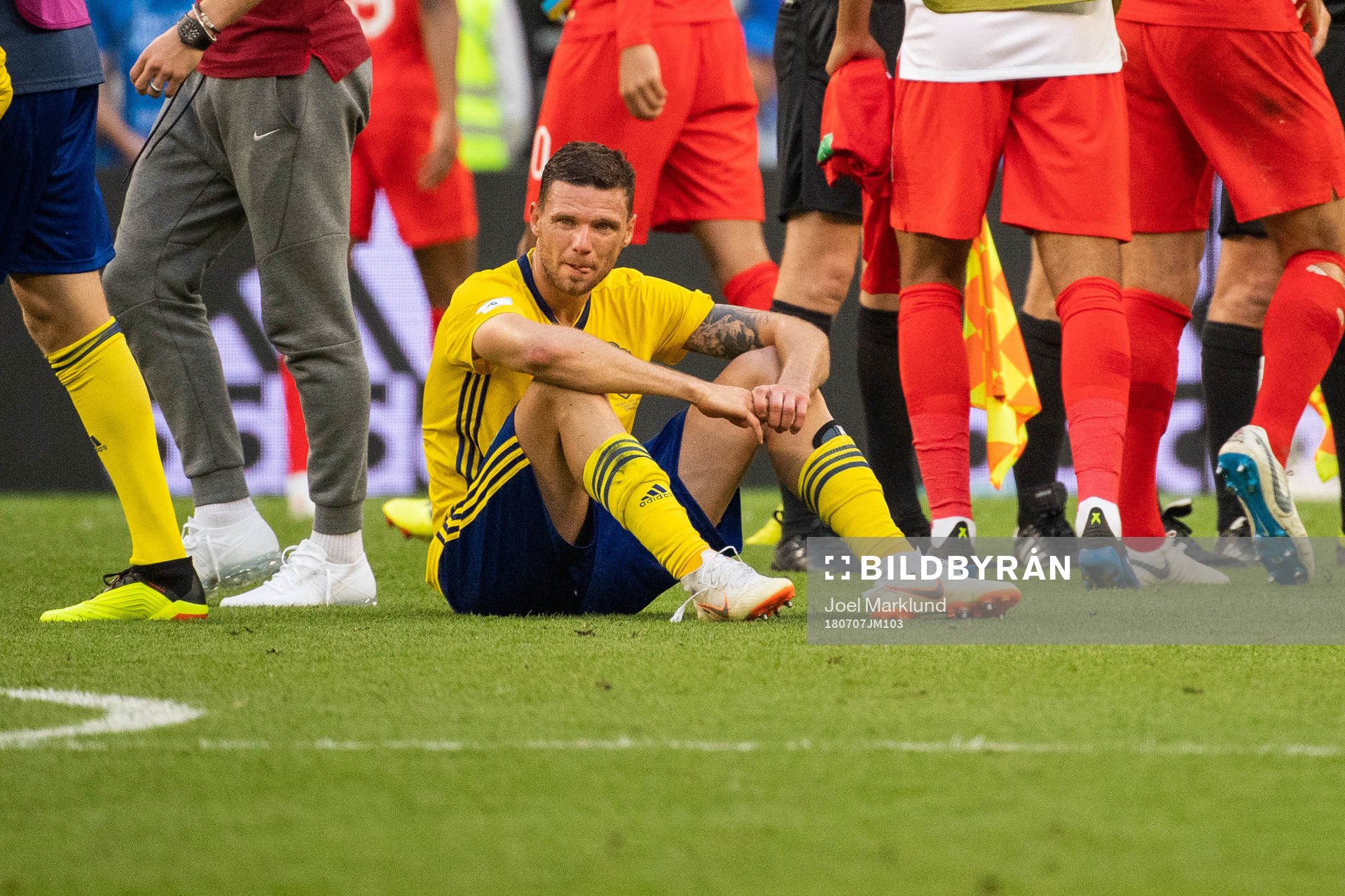 Marcus Berg of Sweden sits down looking dejected