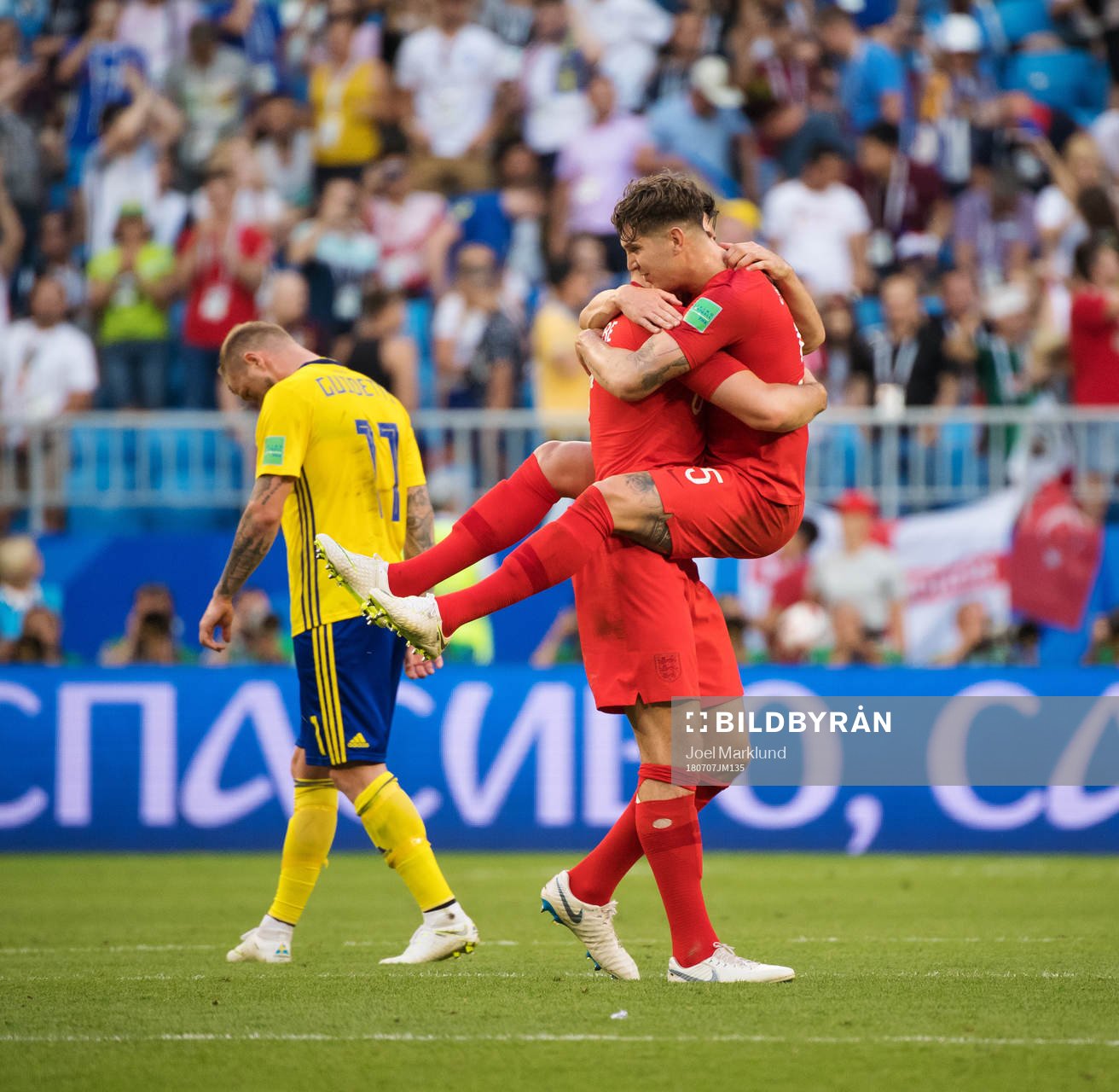 John Guidetti of Sweden look dejected while Harry Maguire