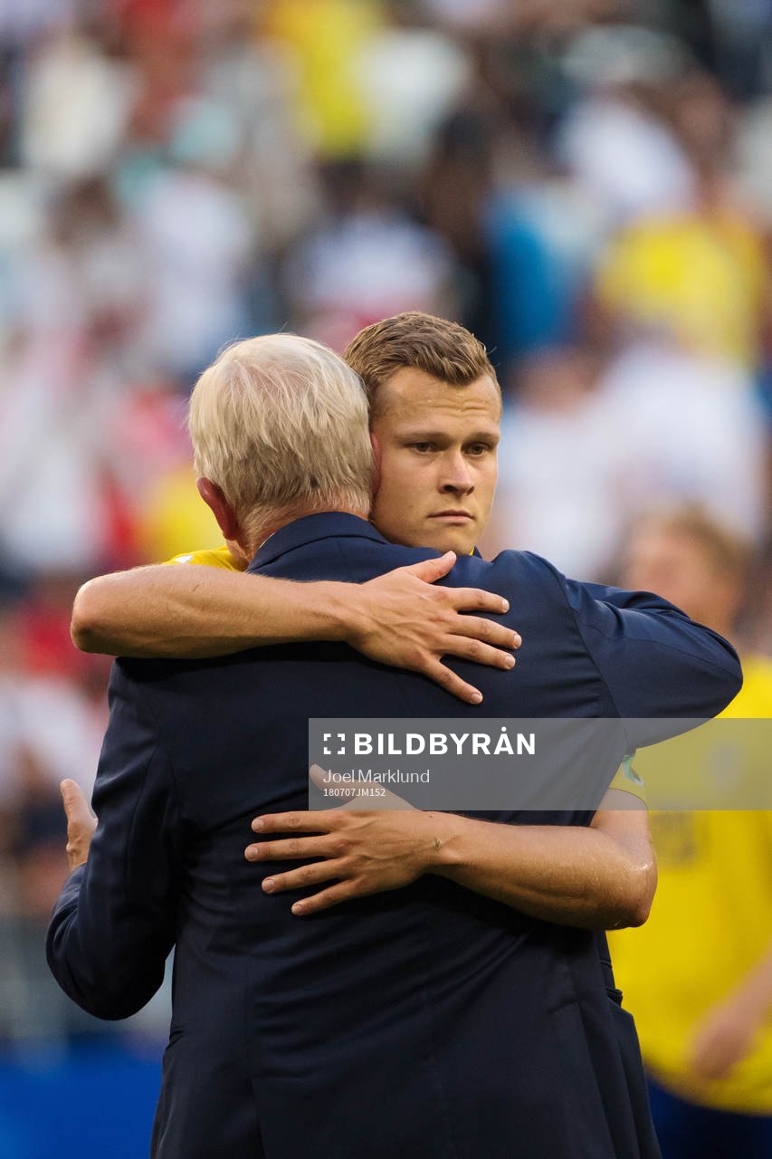 Team Manager Lars Richt of Sweden hugs Viktor Claesson