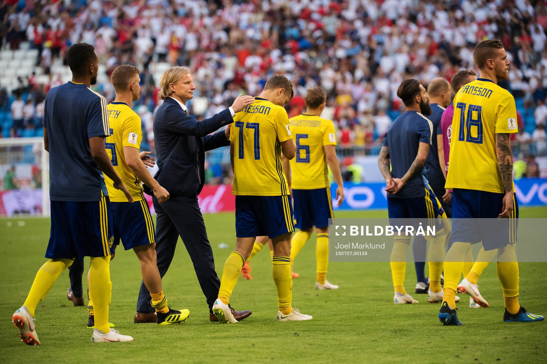 Assistant Team Manager Stefan Pettersson of Sweden comforts