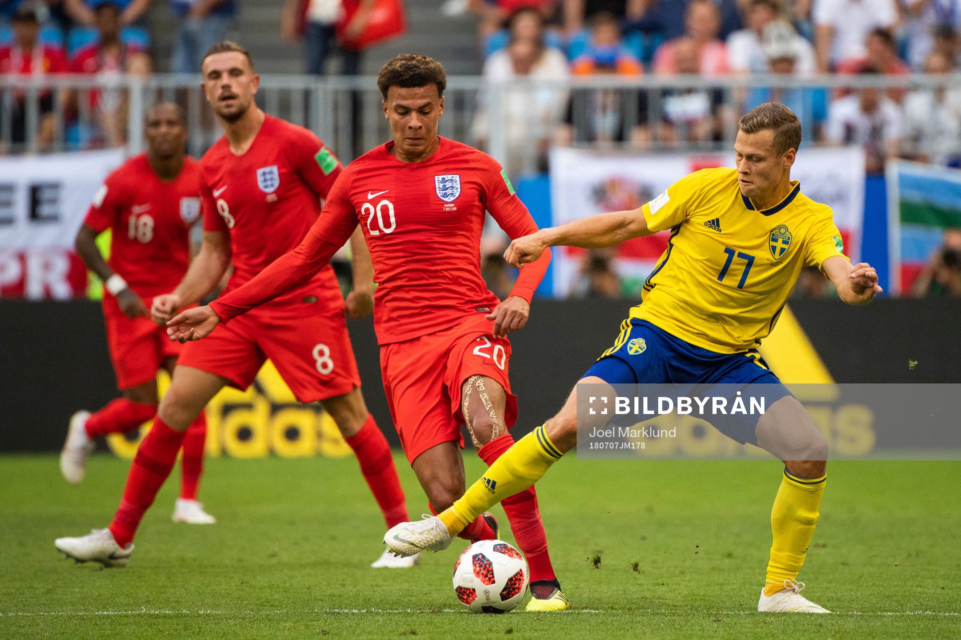 Dele Alli of England and Viktor Claesson of Sweden