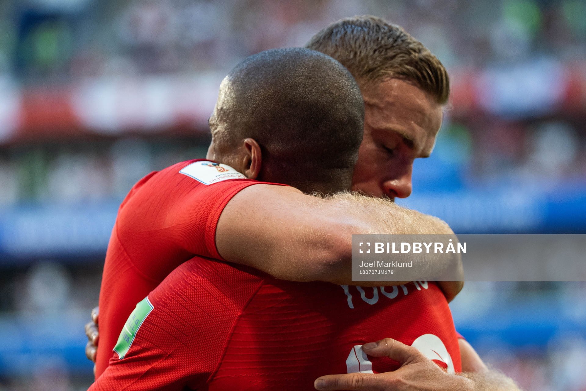 Ashley Young and Jordan Henderson of England  hugs when