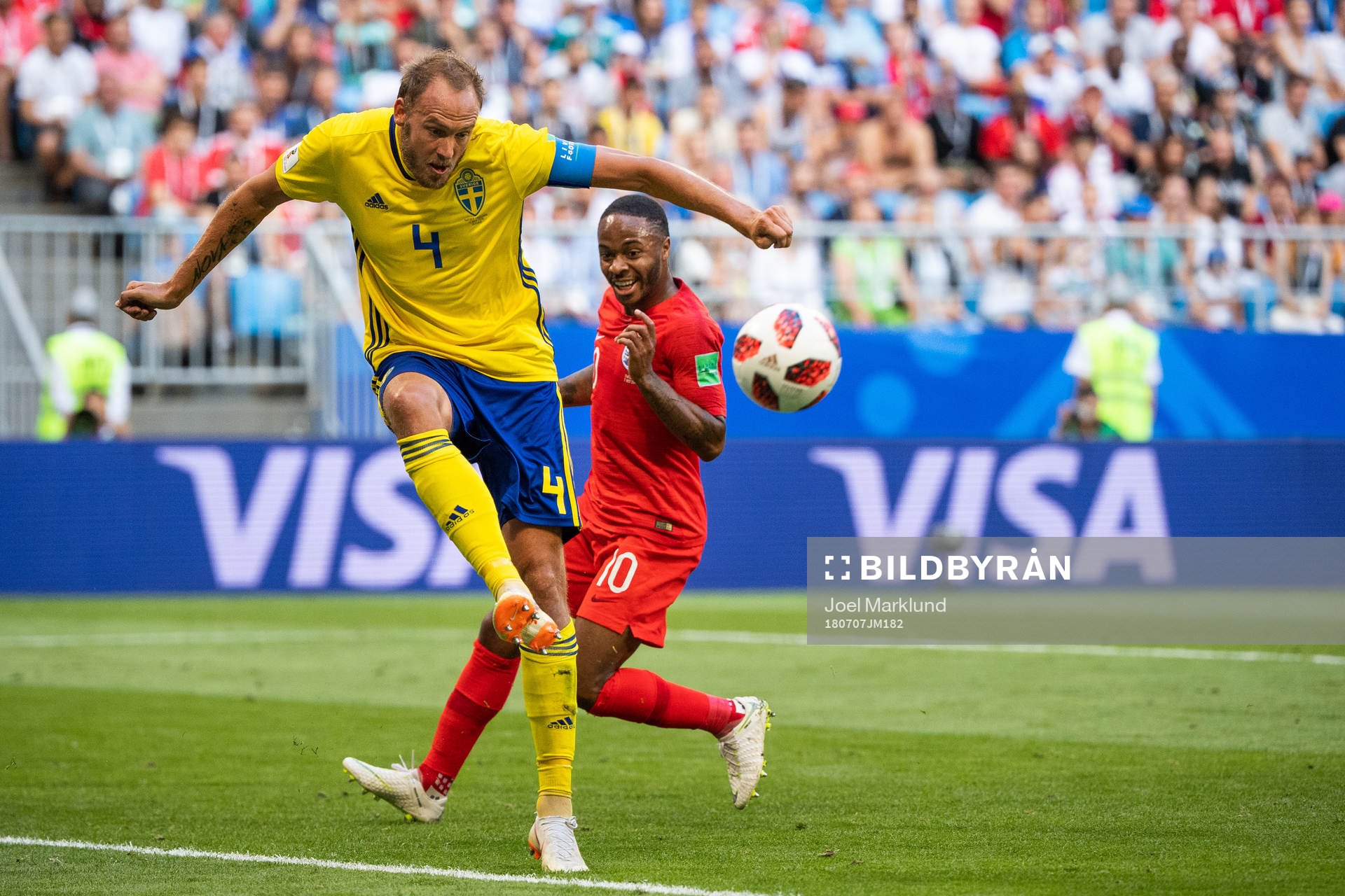 Andreas Granqvist of Sweden and Raheem Sterling of England
