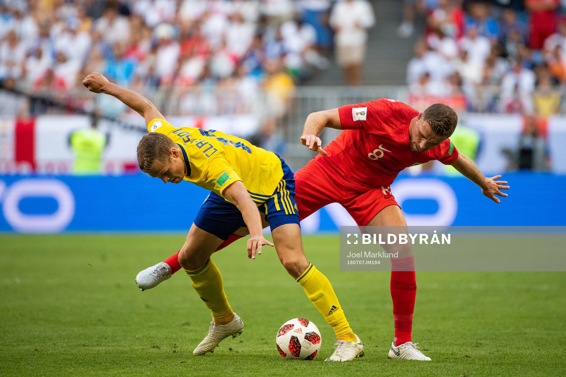 Viktor Claesson of Sweden and Jordan Henderson of England