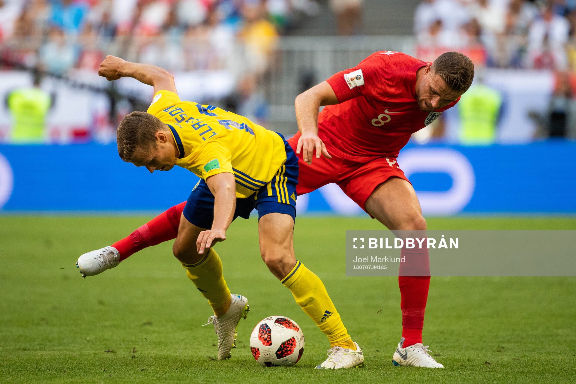 Viktor Claesson of Sweden and Jordan Henderson of England