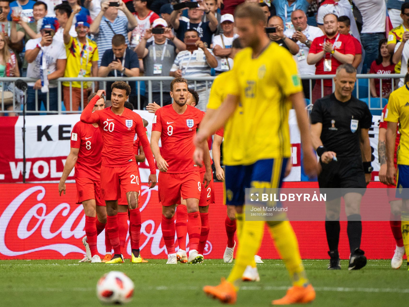 Dele Alli of England celebrates with team mates