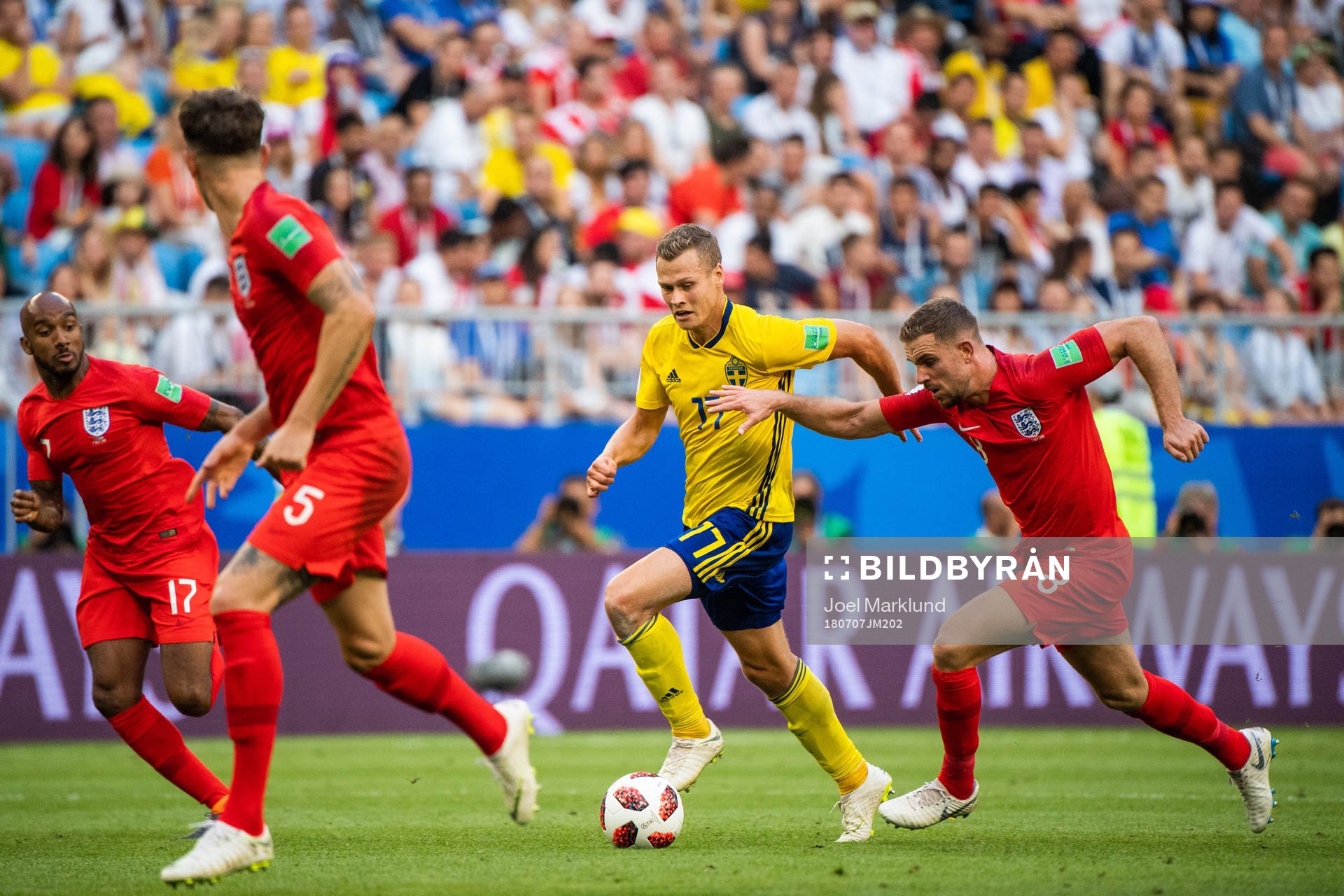 Viktor Claesson of Sweden and Jordan Henderson of England