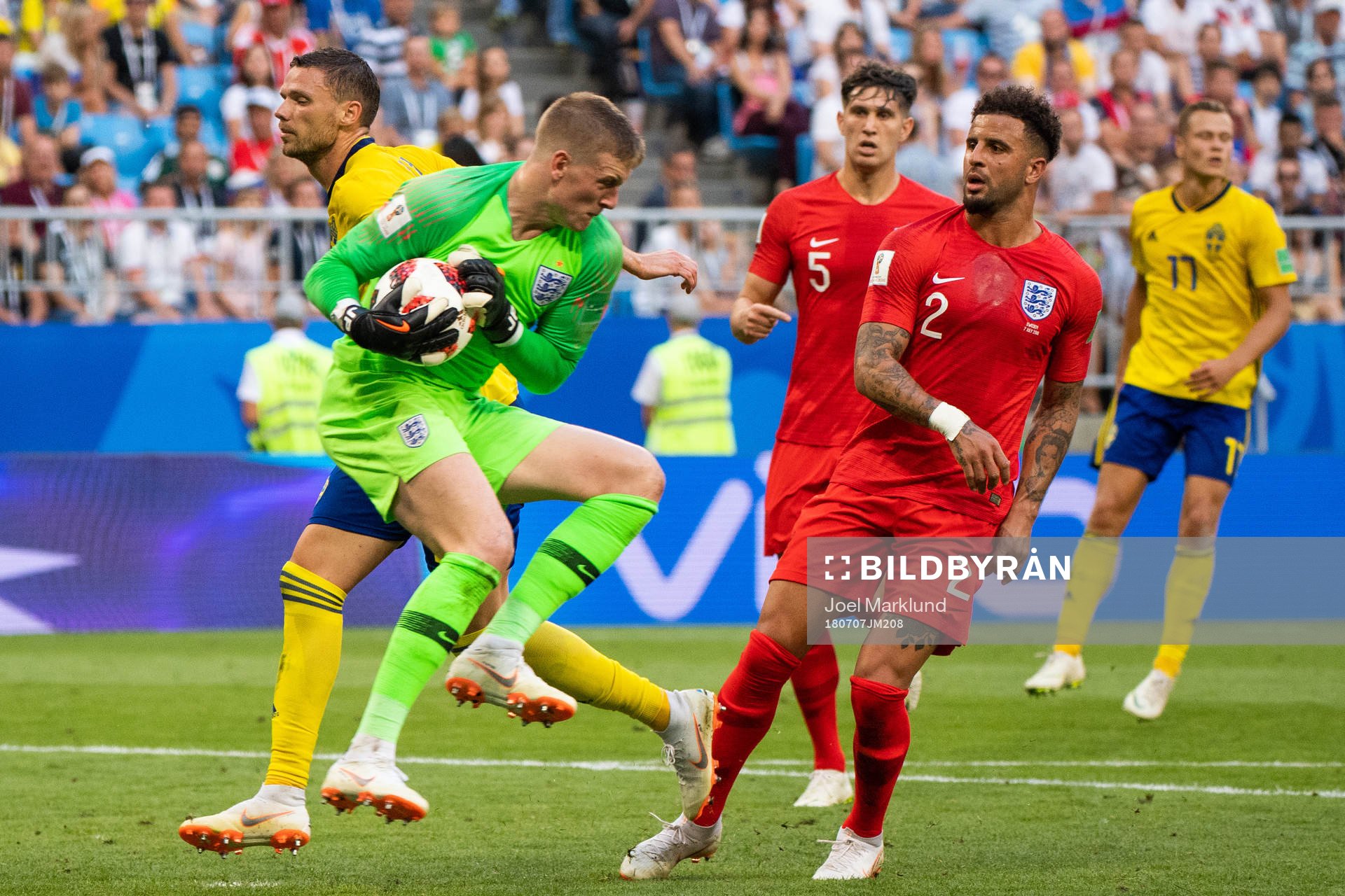Marcus Berg of Sweden uses his arm against goalkeeper