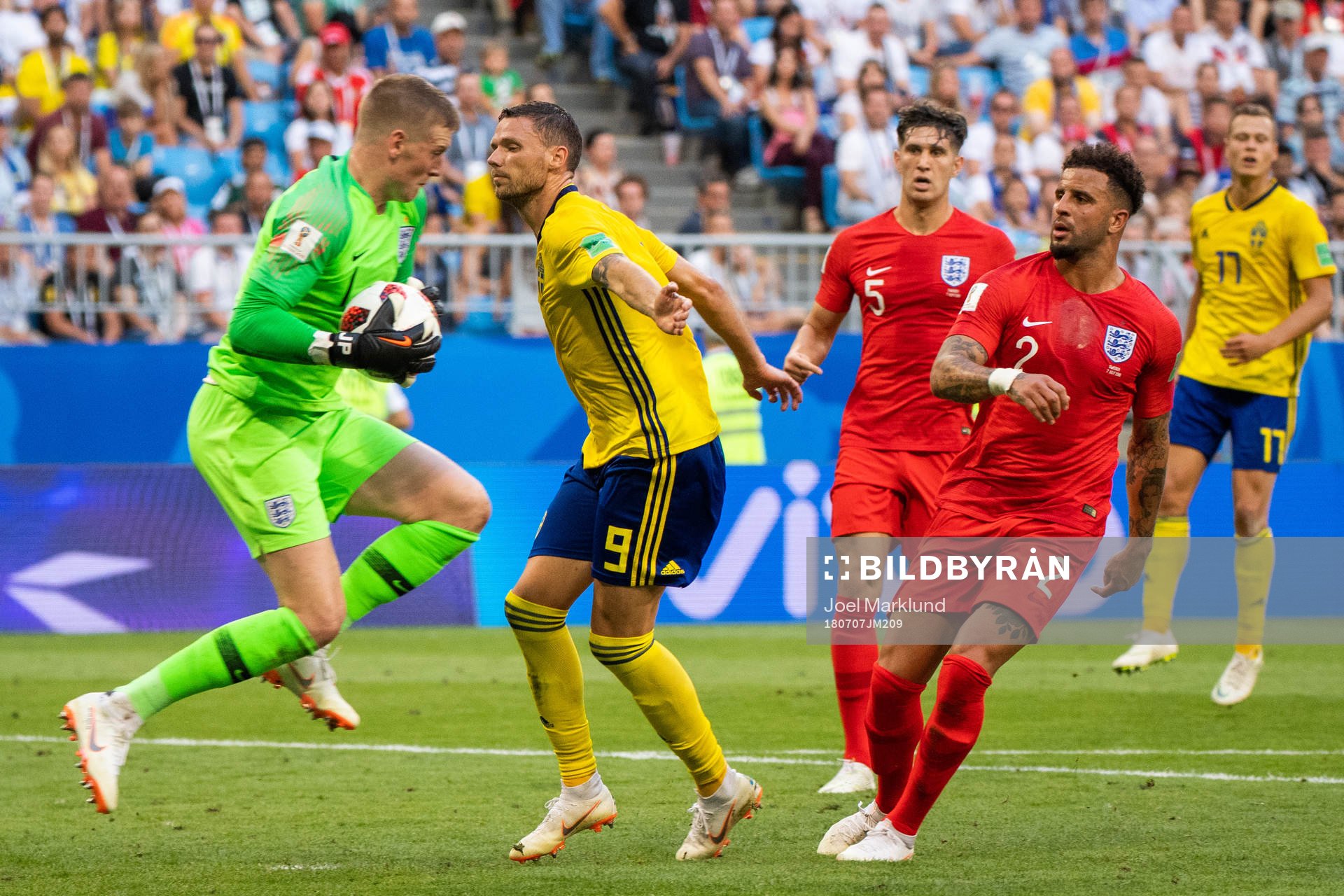 Marcus Berg of Sweden uses his arm against goalkeeper