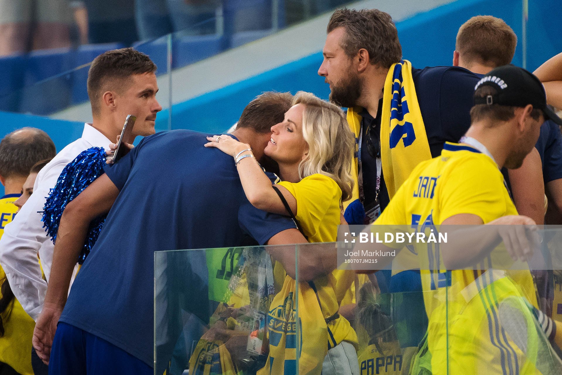 Andreas Granqvist of Sweden gets a hug from Tina Larsson,