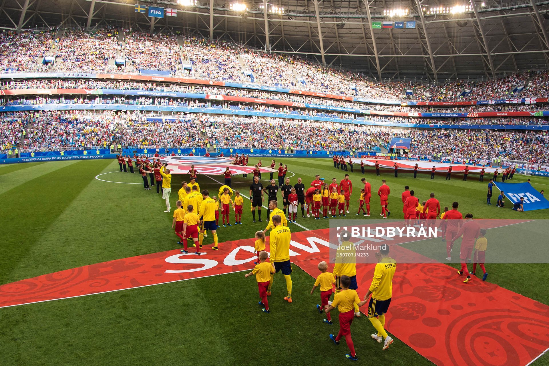 Players of team Sweden and England make their entrance to