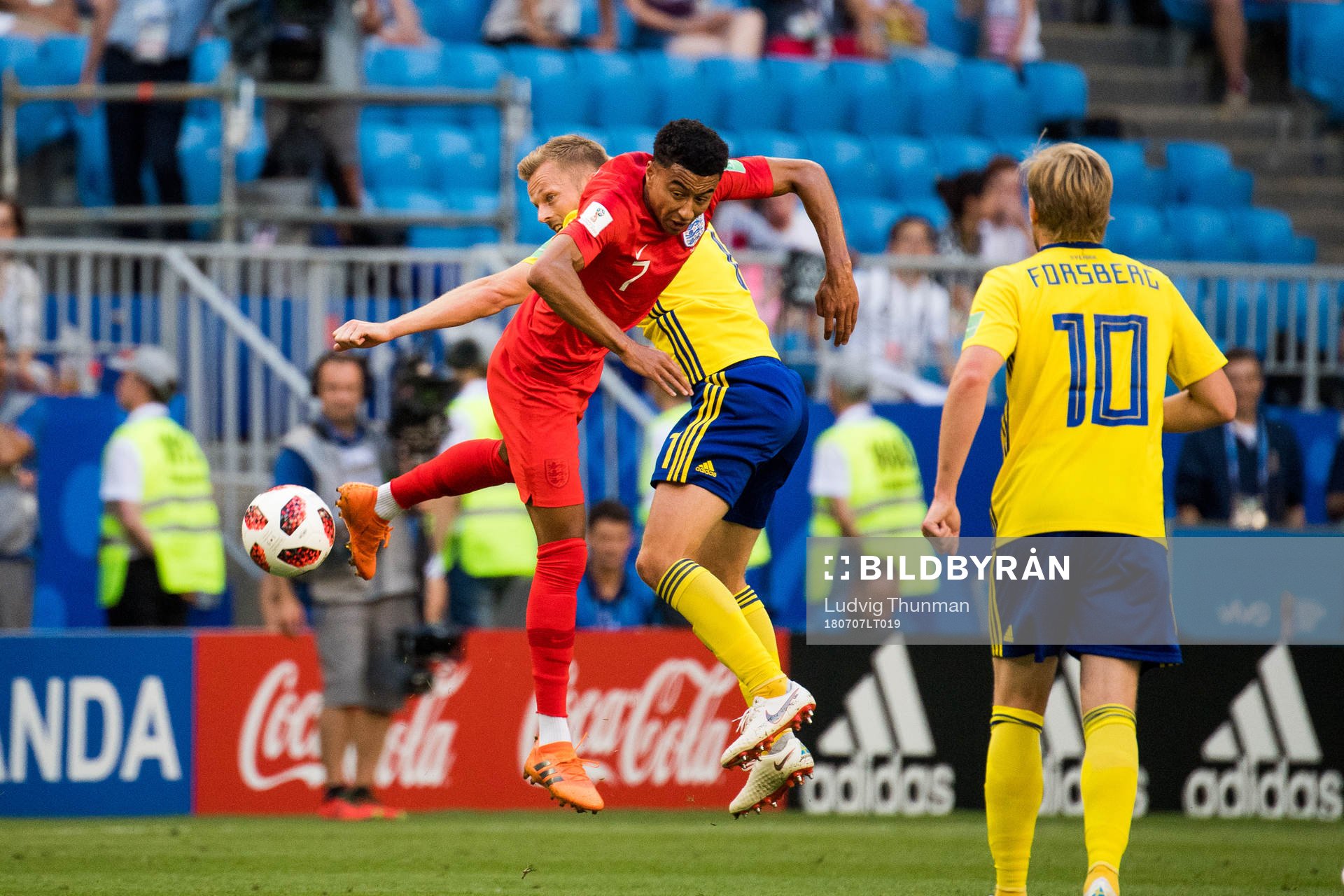 Jesse Lingard of England and Sebastian Larsson of Sweden