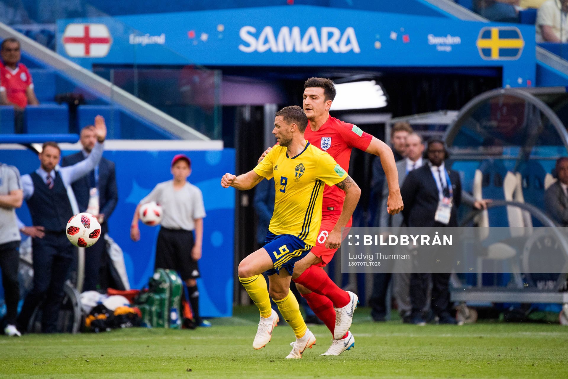 Marcus Berg of Sweden and Harry Maguire of England